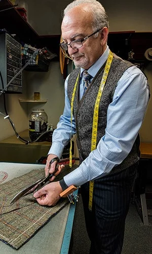 Master Rudolf Tailor Cutting Fabric Green Bay WI