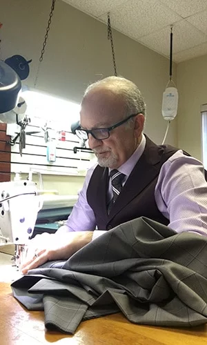 Master Rudolf Tailor Working with Sewing Machine